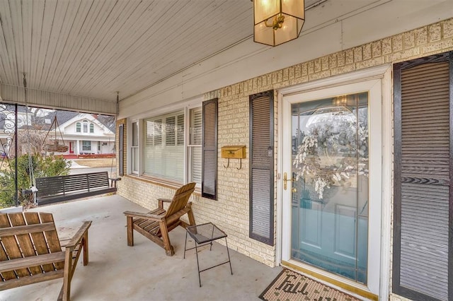 doorway to property with a porch