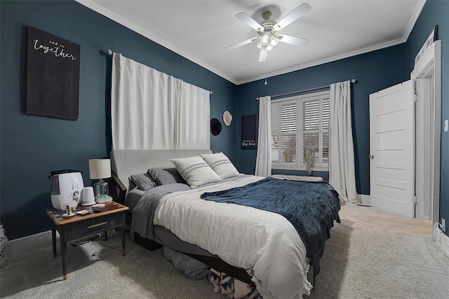 carpeted bedroom featuring ornamental molding and ceiling fan