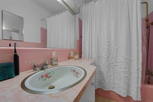 bathroom with crown molding, decorative backsplash, vanity, and shower / bath combo with shower curtain