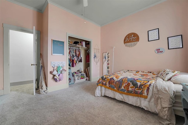 bedroom with ornamental molding, carpet, ceiling fan, and a closet