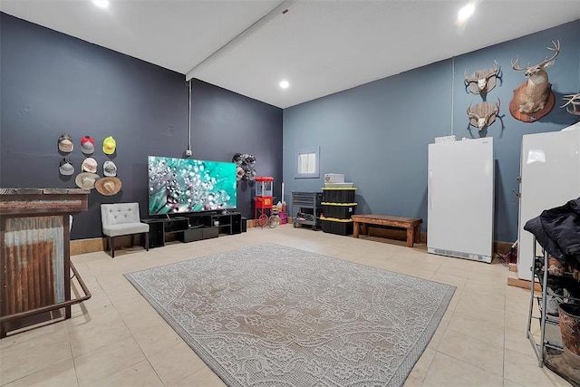 living room featuring vaulted ceiling and light tile patterned floors