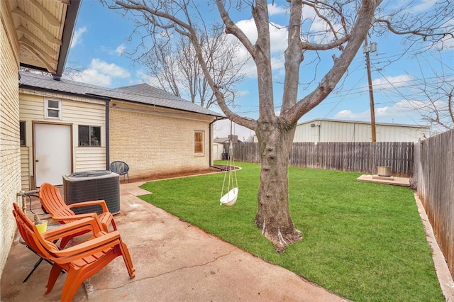 view of yard featuring a patio and central air condition unit