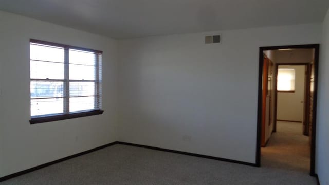 empty room featuring carpet floors