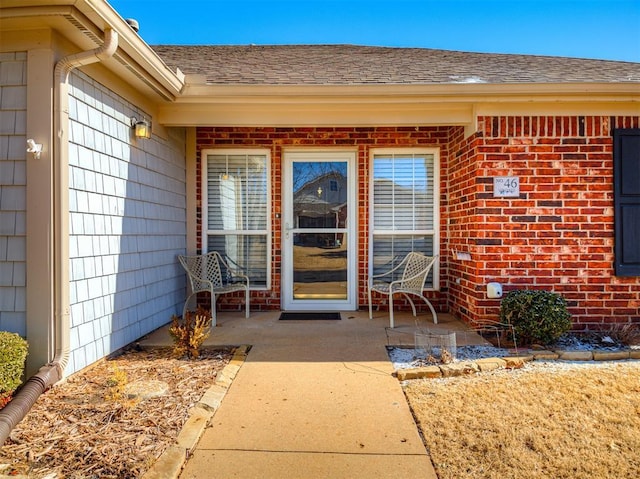 entrance to property with a patio area