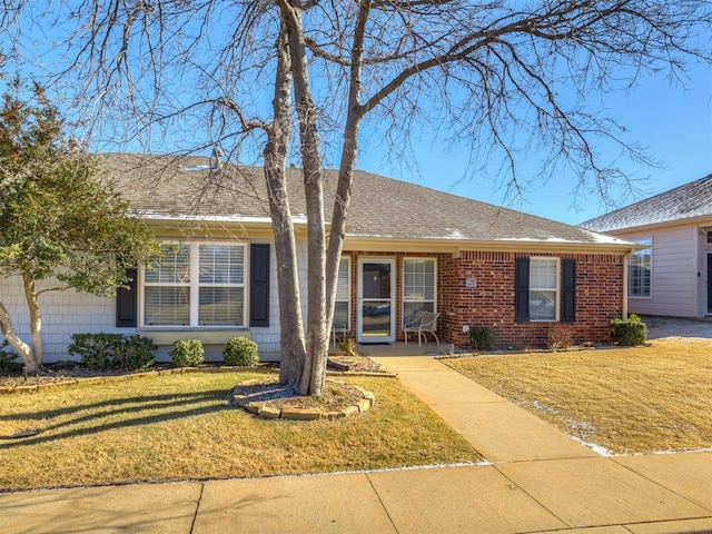 ranch-style house with a front lawn