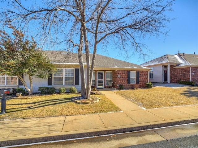 ranch-style house with a front lawn