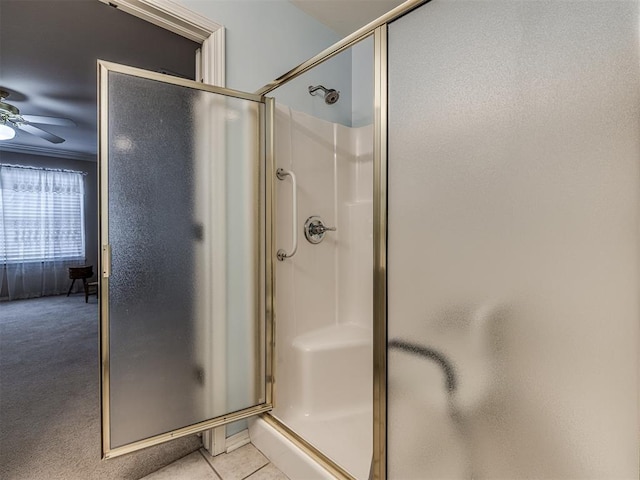 bathroom featuring tile patterned flooring, ceiling fan, and walk in shower