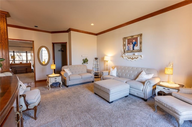 carpeted living room featuring ornamental molding