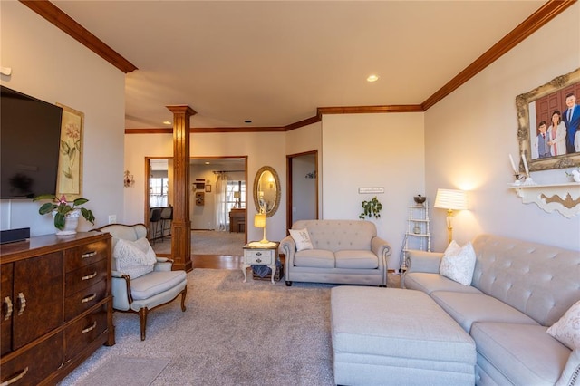 carpeted living room with ornate columns and ornamental molding