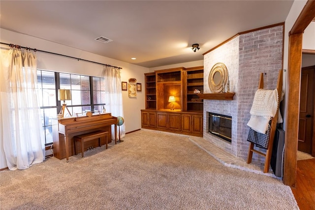 carpeted living room featuring a fireplace