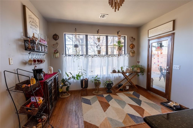 entryway with hardwood / wood-style flooring