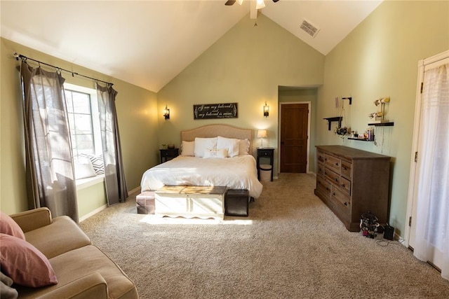 carpeted bedroom with high vaulted ceiling and ceiling fan