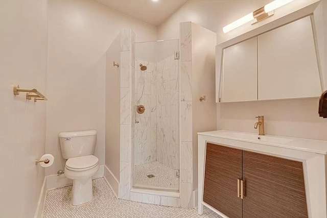 bathroom featuring an enclosed shower, vanity, tile patterned floors, and toilet