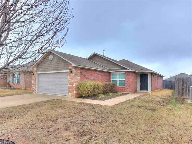 ranch-style home featuring a garage and a front lawn