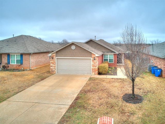 ranch-style house with a garage and a front yard