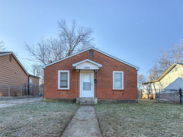 bungalow with a front yard