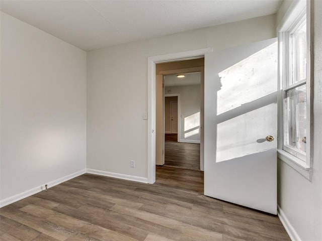 unfurnished room featuring hardwood / wood-style floors