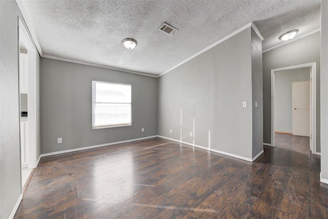 unfurnished room with dark wood-type flooring, a textured ceiling, and ornamental molding