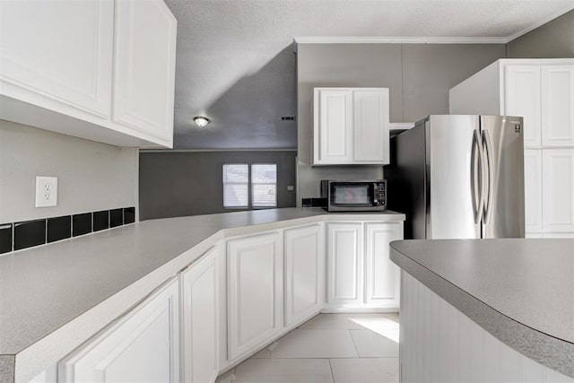 kitchen with white cabinetry and appliances with stainless steel finishes