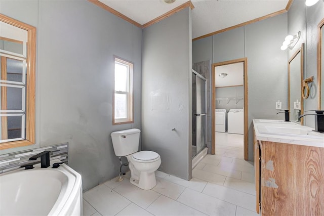 full bathroom with vanity, ornamental molding, independent washer and dryer, and separate shower and tub