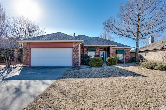 ranch-style home featuring a garage