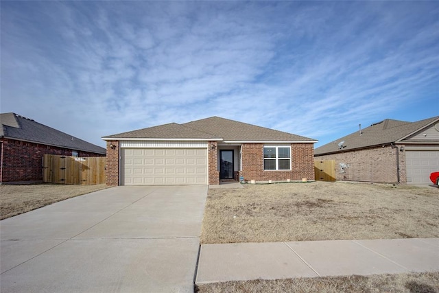 ranch-style home featuring a garage