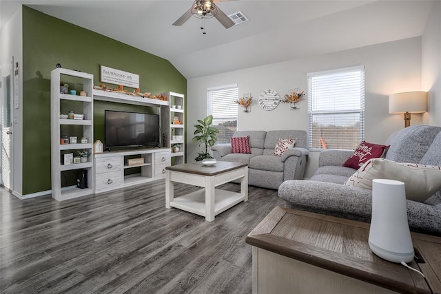 living room featuring lofted ceiling, dark hardwood / wood-style floors, and ceiling fan