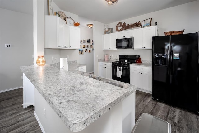 kitchen with white cabinetry, sink, dark hardwood / wood-style flooring, and black appliances