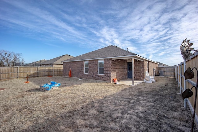 rear view of property featuring a patio area