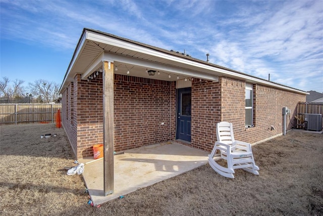 rear view of property featuring central AC and a patio