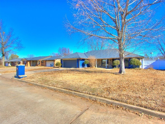 ranch-style house featuring a garage