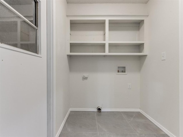 clothes washing area with washer hookup and hookup for an electric dryer