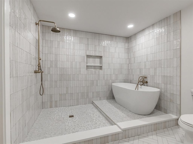 bathroom with independent shower and bath, tile walls, tile patterned floors, and toilet