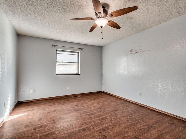 unfurnished room featuring wood-type flooring, ceiling fan, and a textured ceiling