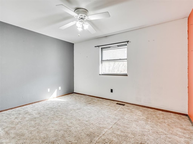 carpeted empty room with ceiling fan