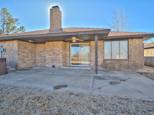 rear view of property with a patio and ceiling fan