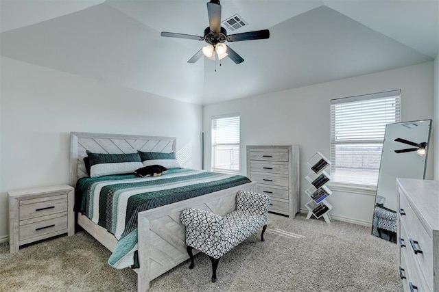 bedroom featuring lofted ceiling, light colored carpet, and ceiling fan