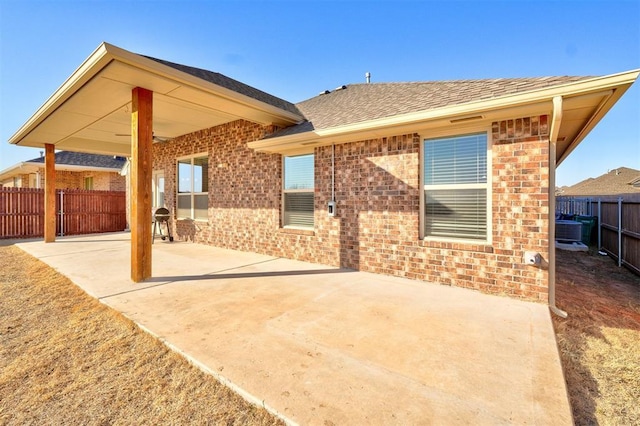 back of property featuring a patio and central air condition unit