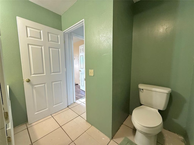 bathroom featuring tile patterned floors and toilet