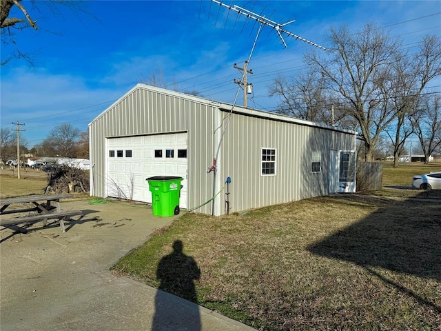 garage featuring a yard