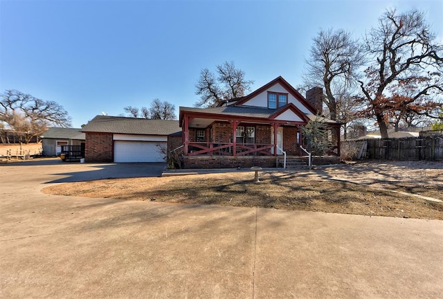 view of front of home with a garage and covered porch