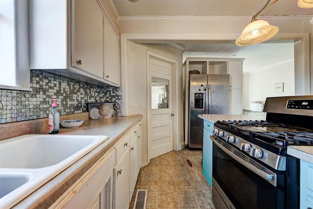 kitchen with appliances with stainless steel finishes, white cabinetry, ornamental molding, decorative backsplash, and decorative light fixtures