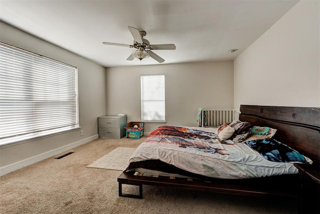 carpeted bedroom with ceiling fan