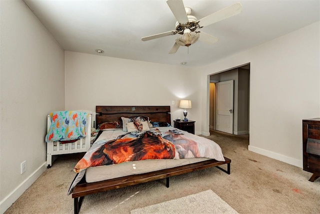 bedroom featuring light carpet and ceiling fan