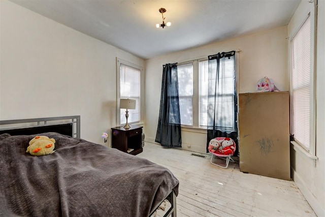 bedroom featuring light wood-type flooring