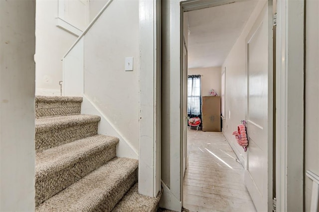 stairway featuring hardwood / wood-style floors