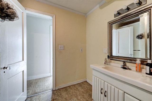 bathroom with vanity and ornamental molding