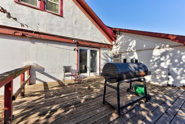 wooden deck with grilling area