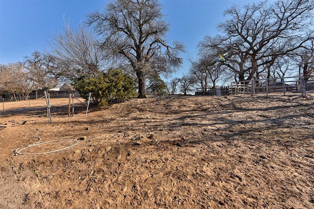 view of yard with a rural view