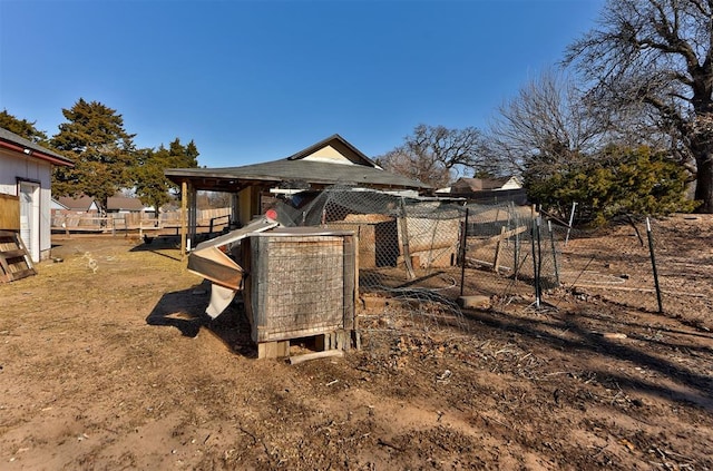 view of playground featuring an outbuilding